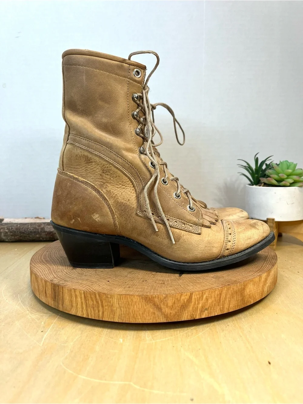 vintage Capezio kiltie cap-toe boots in a stone or tan leather color. Size 6.5